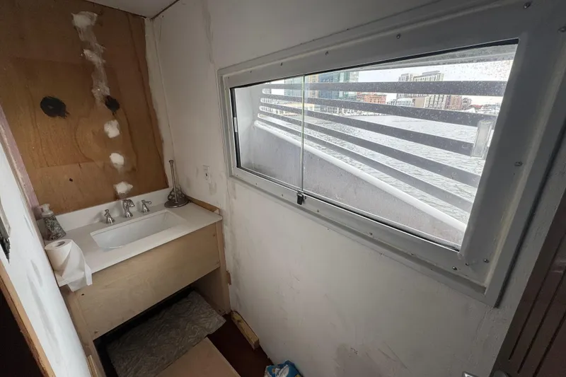 Slide: The Image of Interior helm of 1997 Tarrab 77 Motor Yacht with control panel and seating. - 19