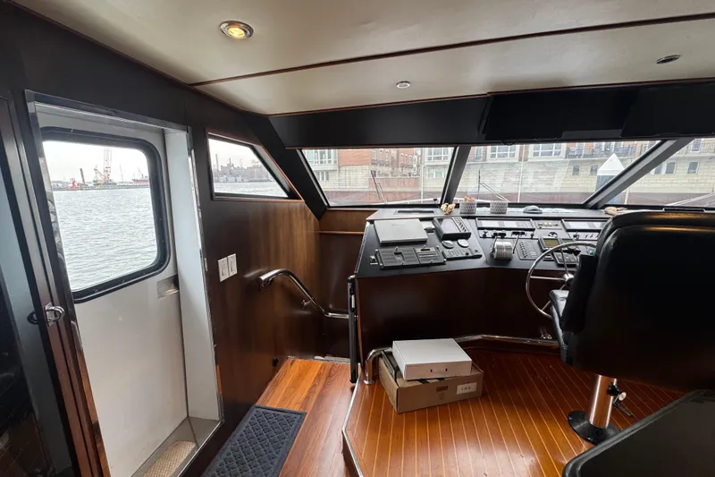 Slide: The Image of Interior helm of 1997 Tarrab 77 Motor Yacht with modern controls and seating. - 20