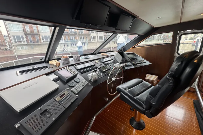 Slide: The Image of Interior of 1997 Tarrab 77 Motor Yacht with helm, seating, and nautical decor. - 23