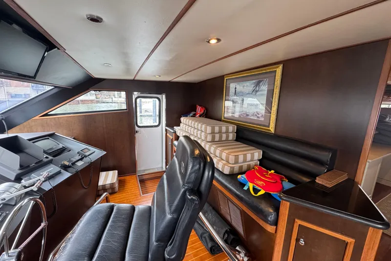 Slide: The Image of Cockpit of a 1997 Tarrab 77 Motor Yacht with navigation equipment and steering wheel. - 24