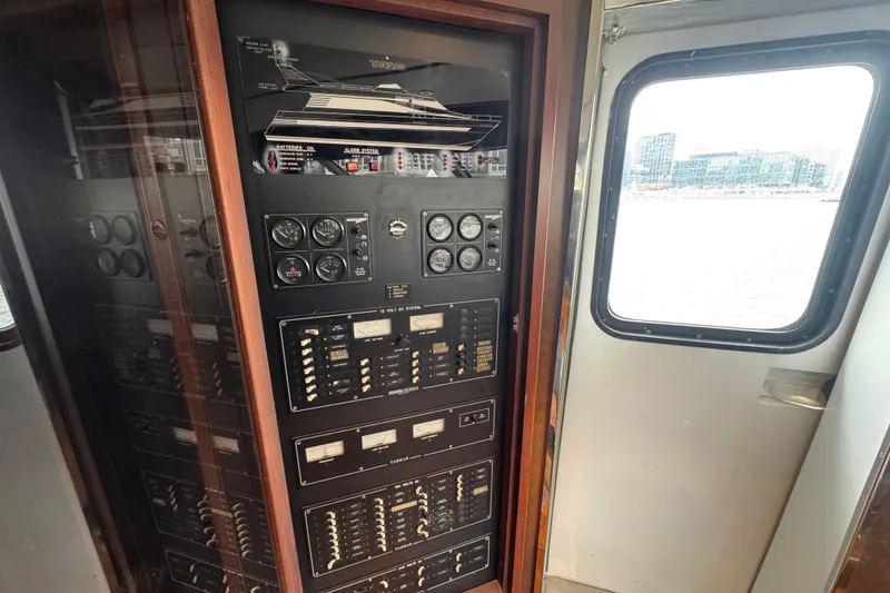 Slide: The Image of 1997 Tarrab 77 Motor Yacht deck view with cityscape background. - 27