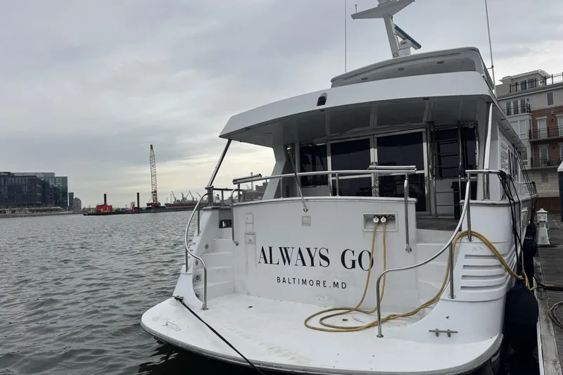 Slide: The Image of Tarrab 77 Motor Yacht 1997 docked in Baltimore, MD, with overcast sky. - 3