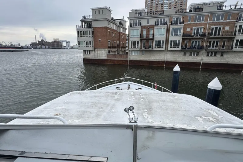 Slide: The Image of Luxurious 1997 Tarrab 77 Motor Yacht deck with seating and waterfront view. - 38