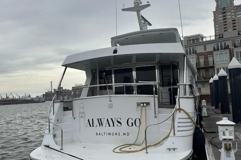 Slide: The Image of Tarrab 77 Motor Yacht, 1997, docked in Baltimore, MD, with cityscape background. - 4