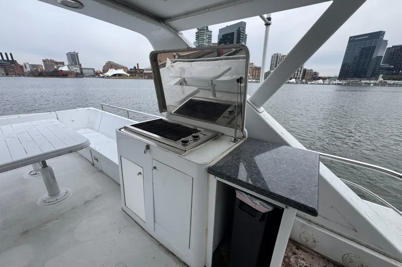 Slide: The Image of Spacious deck of 1997 Tarrab 77 Motor Yacht with waterfront city view. - 40