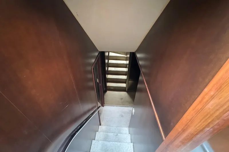 Slide: The Image of Staircase with wooden walls inside 1997 Tarrab 77 Motor Yacht. - 44