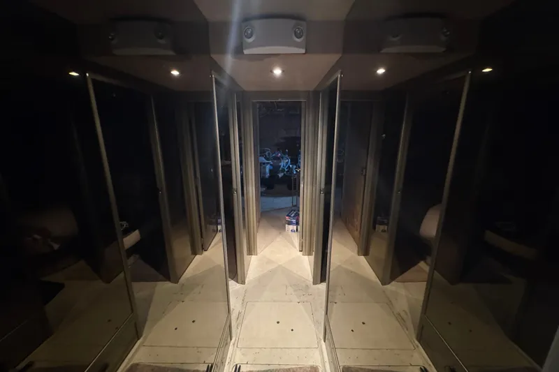 Slide: The Image of Cozy bedroom interior of 1997 Tarrab 77 Motor Yacht with nautical-themed pillows. - 48