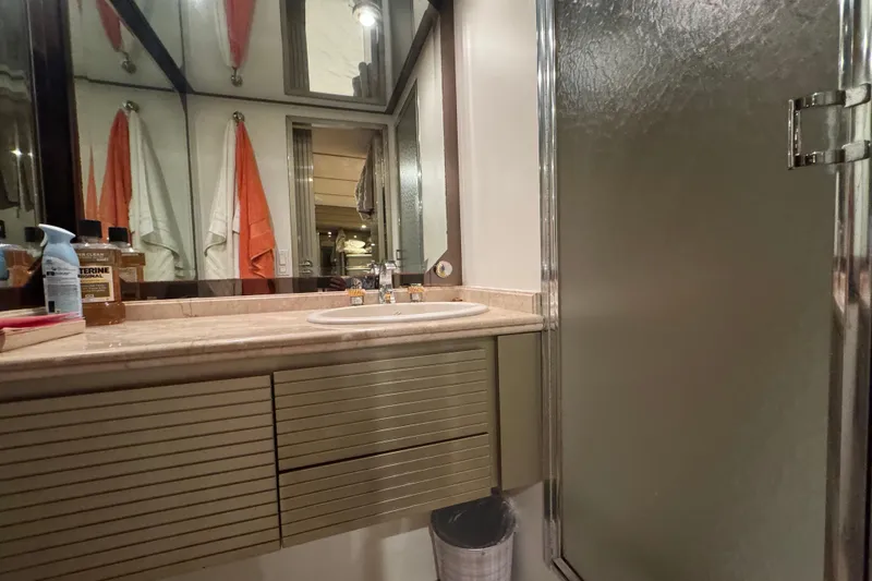 Slide: The Image of Interior closet of 1997 Tarrab 77 Motor Yacht with clothes and storage boxes. - 50