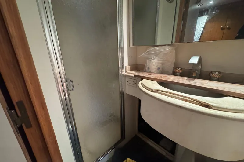 Slide: The Image of Luxurious interior of 1997 Tarrab 77 Motor Yacht with elegant lighting and plush bedding. - 52