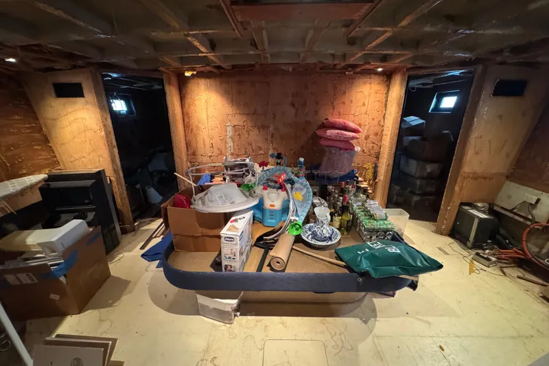 Slide: The Image of Interior of a 1997 Tarrab 77 Motor Yacht with storage and ironing board. - 55