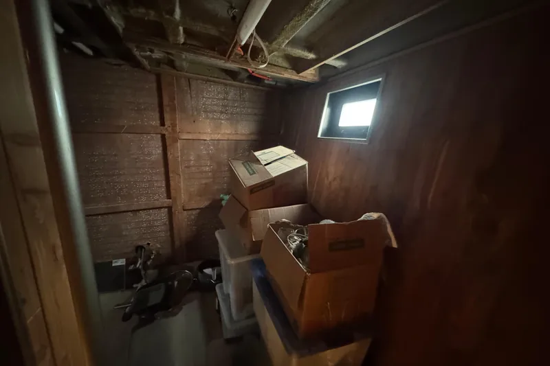 Slide: The Image of Interior of a 1997 Tarrab 77 Motor Yacht under renovation, showing exposed wood and wiring. - 58