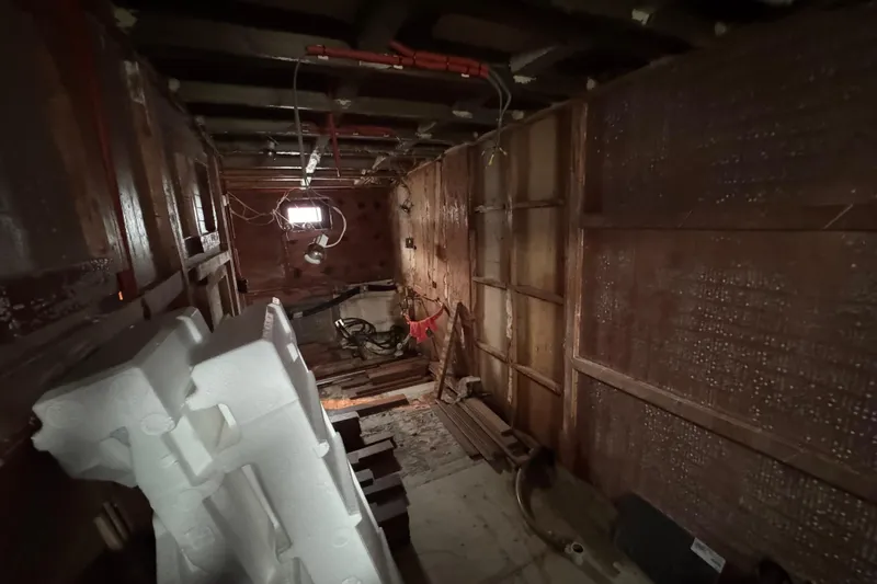 Slide: The Image of Open hatch on 1997 Tarrab 77 Motor Yacht deck, revealing stairs below. - 60