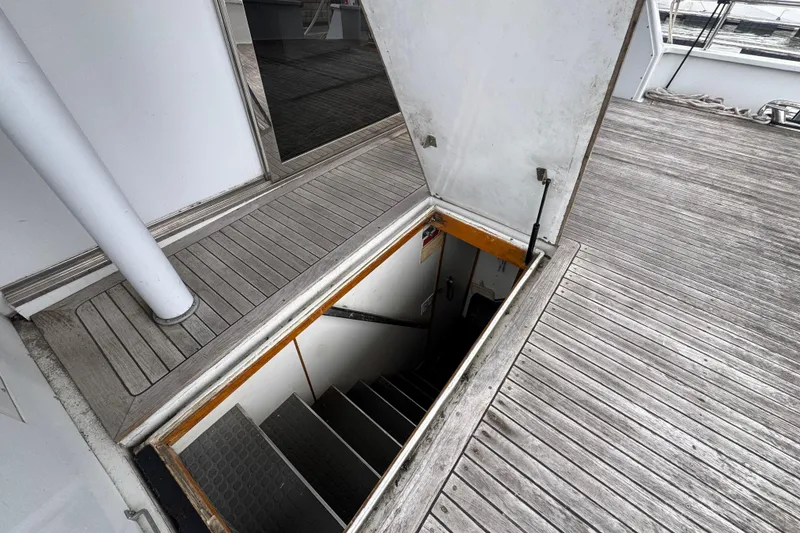 Slide: The Image of Electrical control panel inside a 1997 Tarrab 77 Motor Yacht, featuring various switches and gauges. - 61