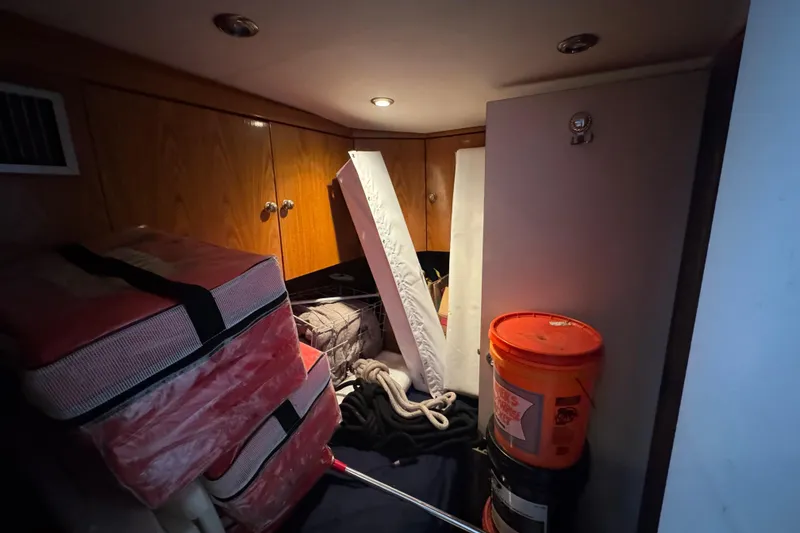 Slide: The Image of Door with porthole on 1997 Tarrab 77 Motor Yacht, featuring fire extinguisher sign. - 63