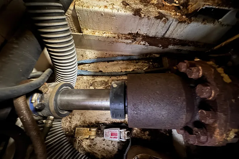 Slide: The Image of Engine room of 1997 Tarrab 77 Motor Yacht with fire extinguisher and machinery. - 69