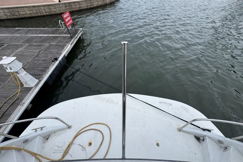 Slide: The Image of Tarrab 77 Motor Yacht (1997) docked at private marina, view from stern. - 7