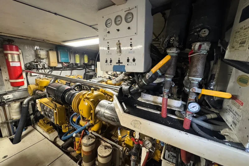 Slide: The Image of Engine room of a 1997 Tarrab 77 Motor Yacht, showcasing mechanical components and equipment. - 72