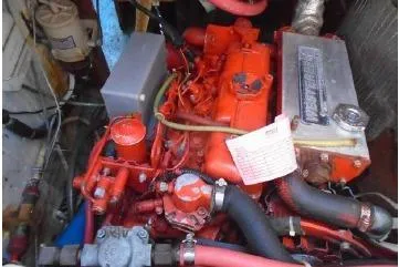 Slide: The Image of 1982 Sabre 34 yacht interior with wooden cabinetry, sink, and stove in the galley area. - 19