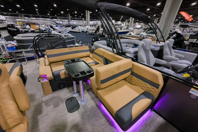 Slide: The Image of Luxurious 2026 Godfrey Monaco 235 SFL pontoon boat with elegant seating and ambient lighting. - 17