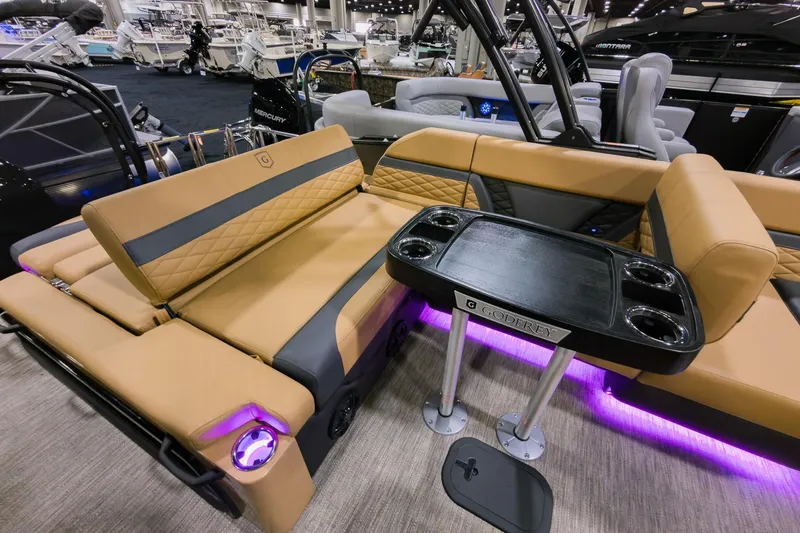 Slide: The Image of Luxurious 2026 Godfrey Monaco 235 SFL boat interior with plush seating and stylish table. - 19