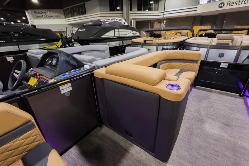 Slide: The Image of 2026 Godfrey Monaco 235 SFL boat interior with luxurious seating and modern dashboard. - 21