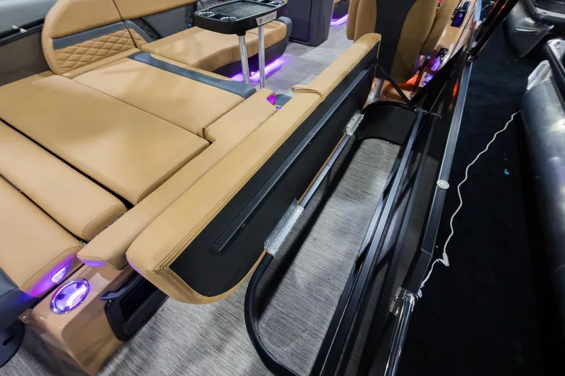 Slide: The Image of Luxurious interior of 2026 Godfrey Monaco 235 SFL with tan seating and ambient lighting. - 35