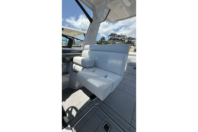 Slide: The Image of Luxurious seating on 2023 Aviara 32AV boat, featuring sleek white upholstery and modern design. - 10