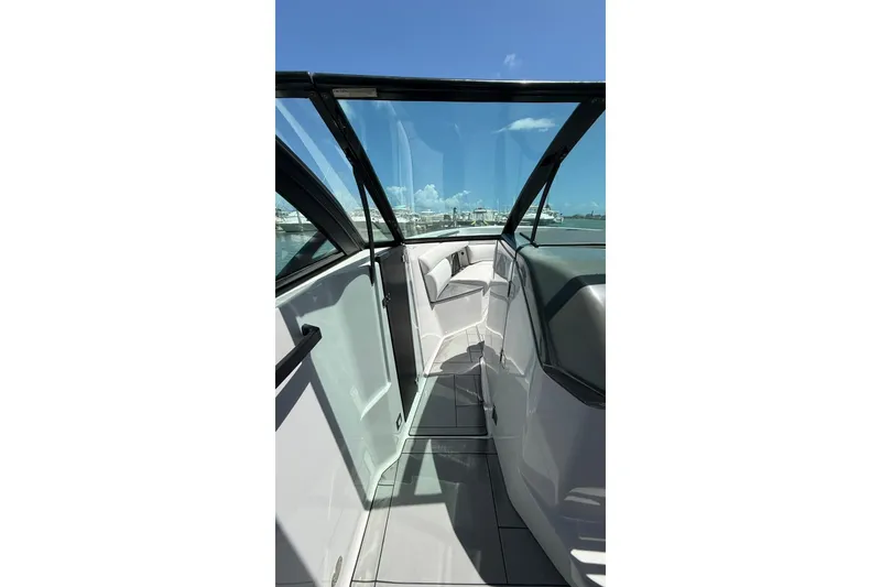 Slide: The Image of 2023 Aviara 32AV boat interior with sleek design and clear glass panels. - 13