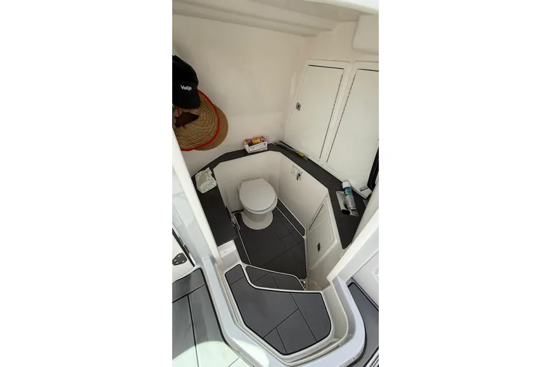 Slide: The Image of 2023 Aviara 32AV boat interior bathroom with modern design and compact layout. - 14
