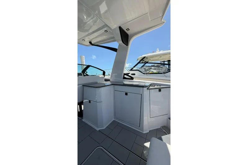Slide: The Image of 2023 Aviara 32AV boat interior with sleek cabinetry and modern design. - 6