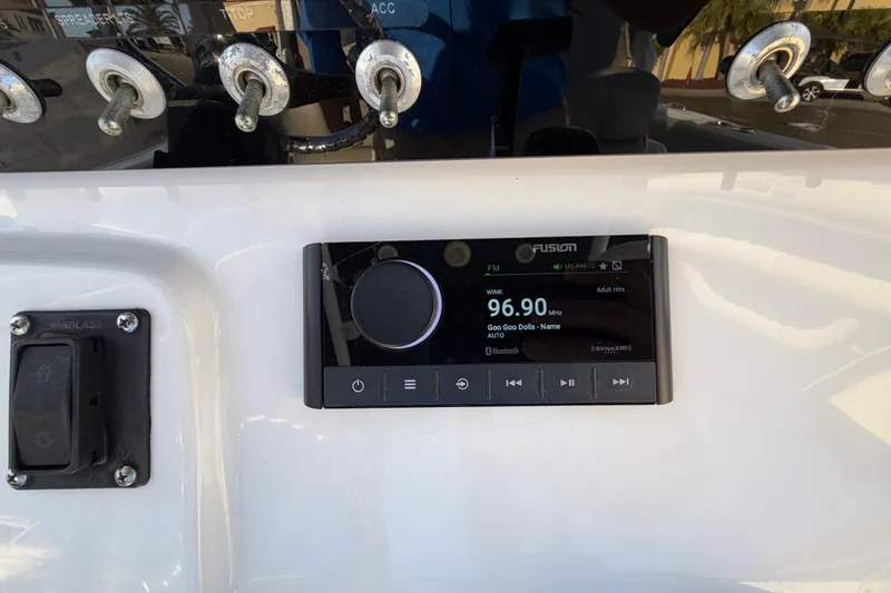 Slide: The Image of 2023 Sportsman Open 232 Center Console with Fusion radio display showing 96.90 FM. - 20