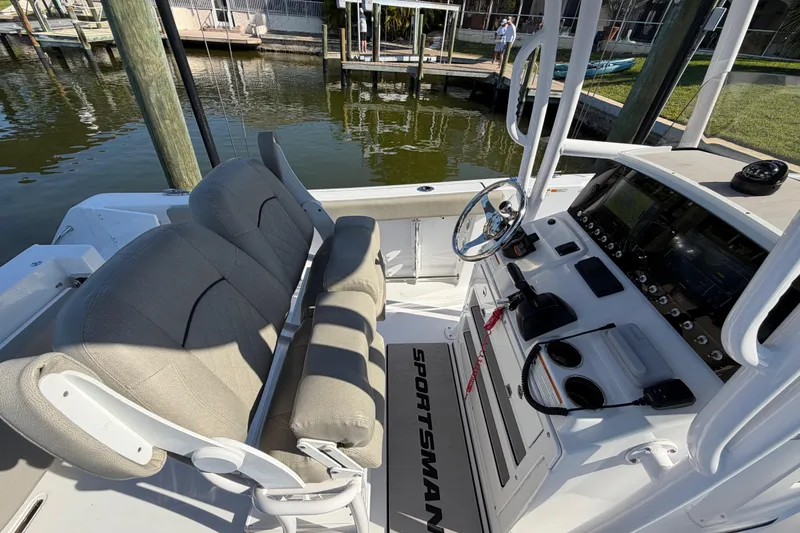 Slide: The Image of 2023 Sportsman Open 232 Center Console boat interior with helm and seating. - 21