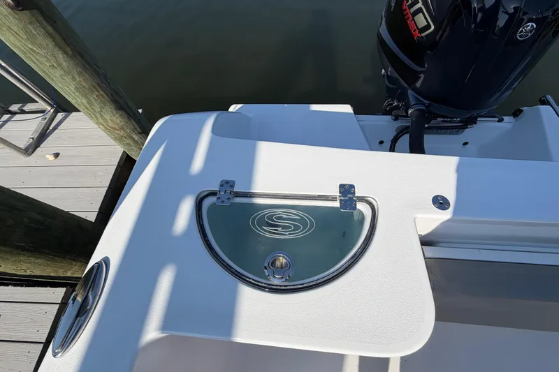 Slide: The Image of 2023 Sportsman Open 232 Center Console boat with Yamaha engine at dock. - 28