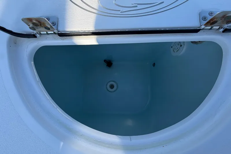 Slide: The Image of Open livewell on 2023 Sportsman Open 232 Center Console boat, showcasing interior details. - 29