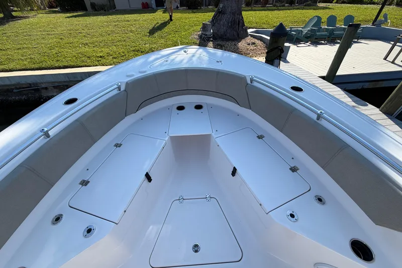 Slide: The Image of 2023 Sportsman Open 232 Center Console boat interior with seating and storage compartments. - 37