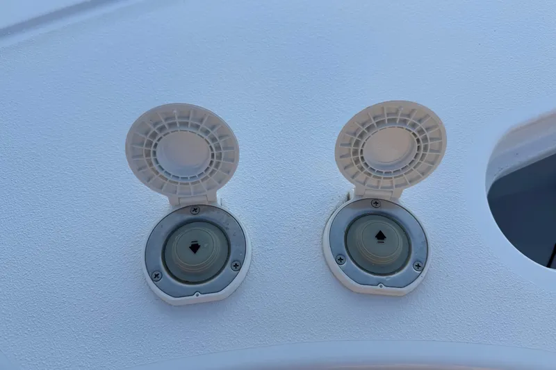 Slide: The Image of Open deck hatches on 2023 Sportsman Open 232 Center Console boat. - 41