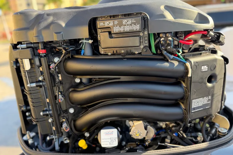 Slide: The Image of 2023 Sportsman Open 232 Center Console engine, detailed view of components and wiring. - 46