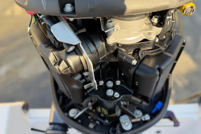 Slide: The Image of 2023 Sportsman Open 232 Center Console engine close-up, showcasing intricate mechanical components. - 47