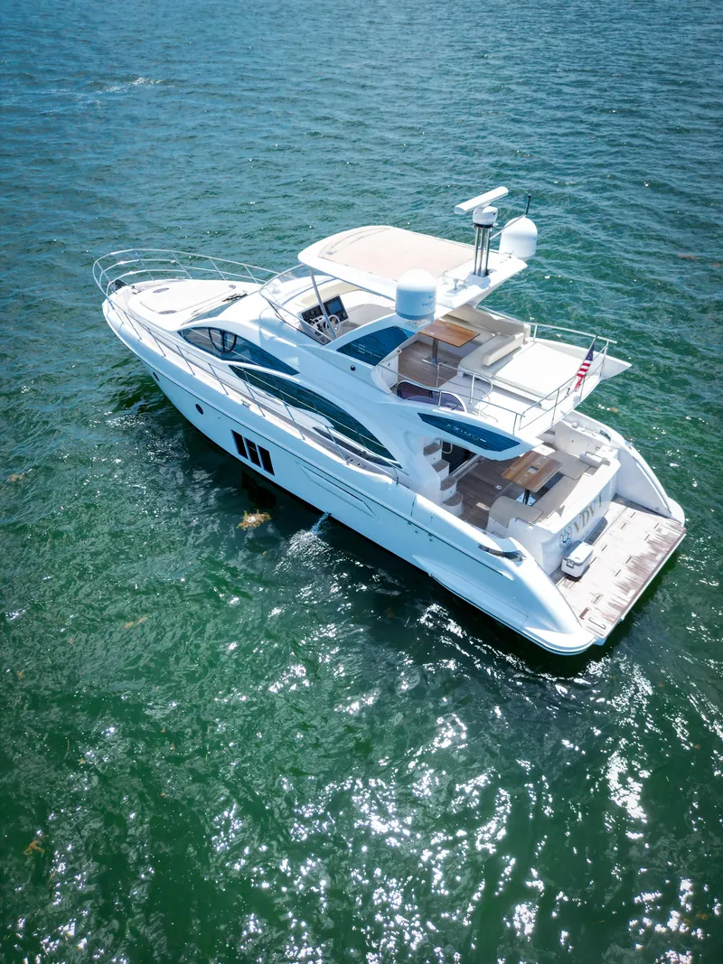 Slide: The Image of Luxurious 2015 Azimut 54 Fly yacht cruising on open water. - 29