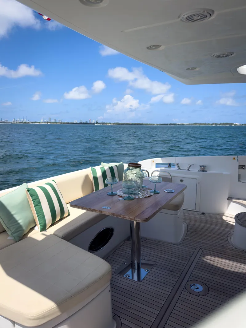 Slide: The Image of Azimut 54 Fly 2015 yacht deck with seating, table, and ocean view. - 32