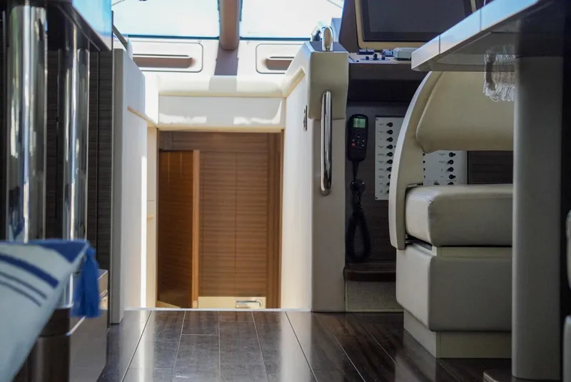 Slide: The Image of Interior of 2015 Azimut 54 Fly yacht, featuring sleek design and modern controls. - 38