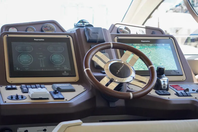 Slide: The Image of Cockpit of 2015 Azimut 54 Fly yacht with Raymarine navigation displays and steering wheel. - 39