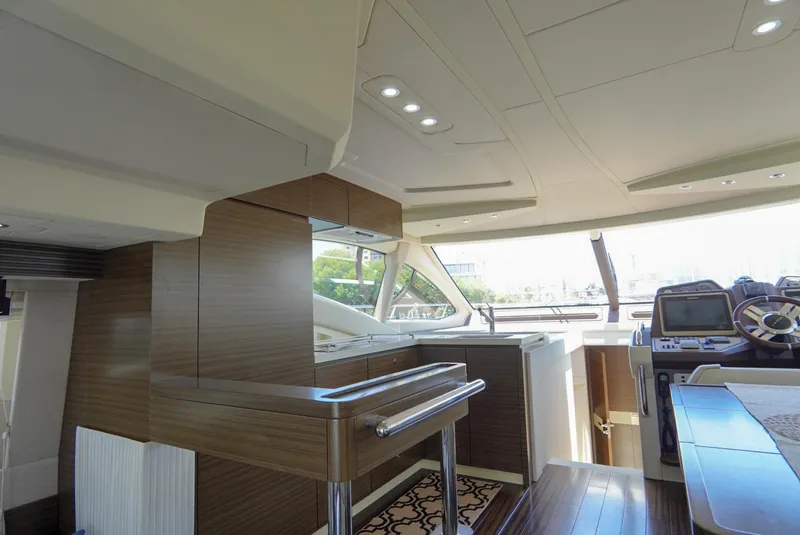 Slide: The Image of Luxurious interior of 2015 Azimut 54 Fly yacht with modern helm and sleek wood finishes. - 40