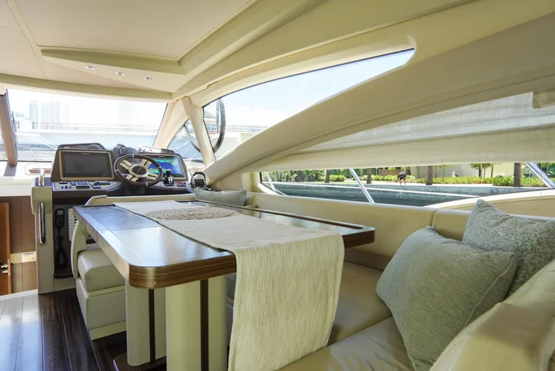 Slide: The Image of Luxurious interior of 2015 Azimut 54 Fly yacht with elegant seating and navigation controls. - 43