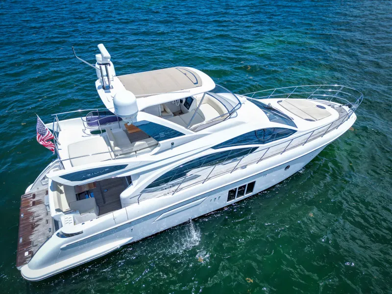 Slide: The Image of 2015 Azimut 54 Fly yacht cruising on blue ocean waters. - 9