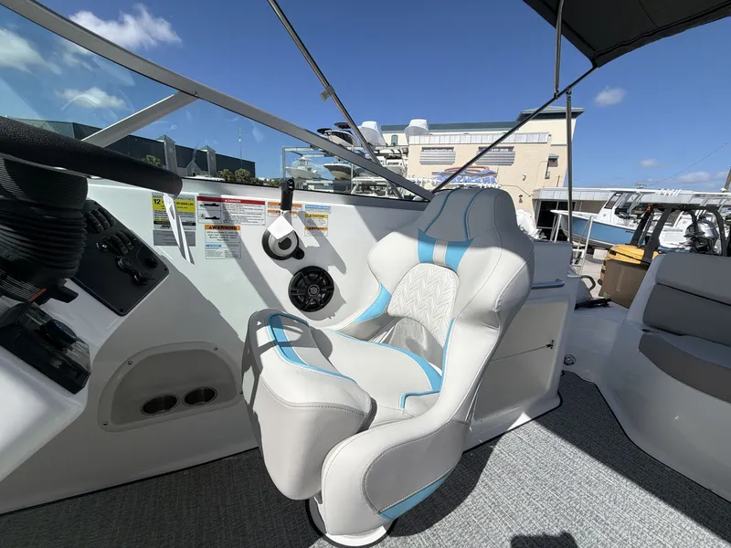 Slide: The Image of Interior of 2026 Hurricane 2400 SD with luxurious captain's chair. - 11