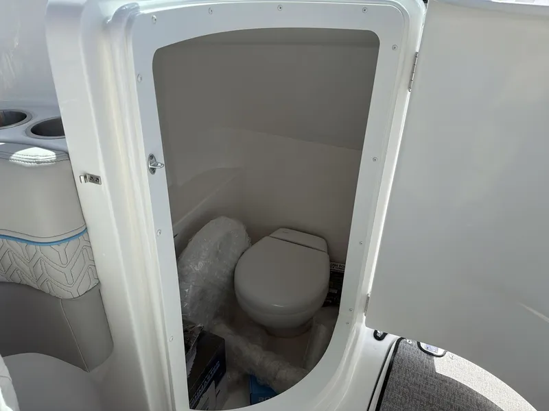 Slide: The Image of Interior of 2026 Hurricane 2400 SD featuring a toilet. - 13