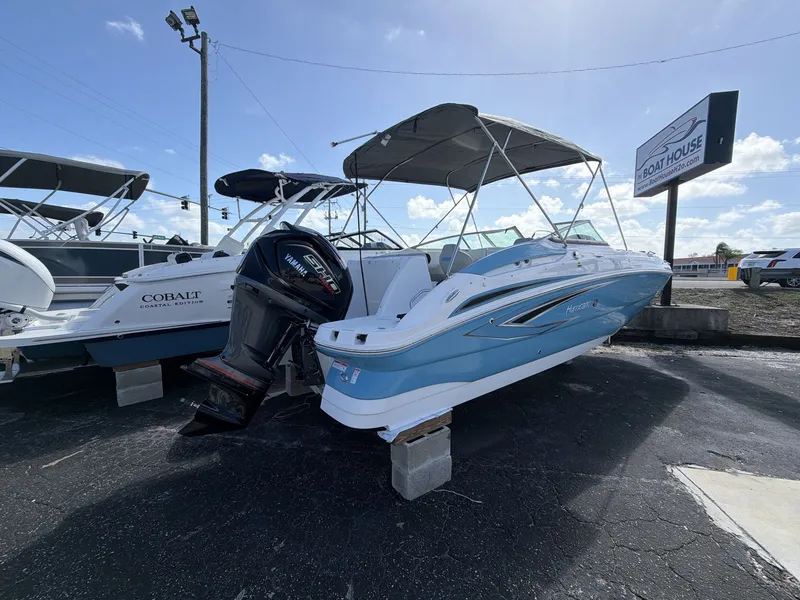 Slide: The Image of 2026 Hurricane 2400 SD boat displayed on parking lot. - 16