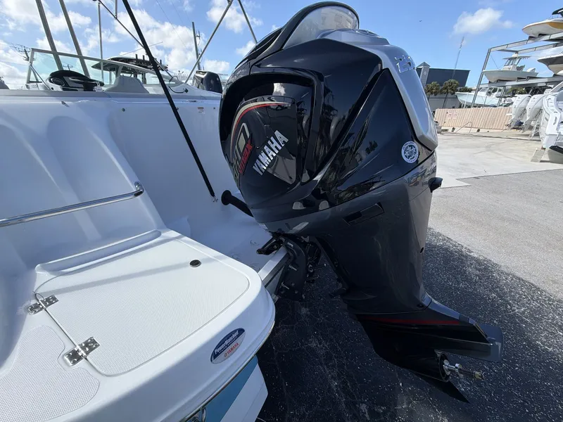 Slide: The Image of Hurricane 2400 SD 2026 with Yamaha outboard motor, side view. - 17
