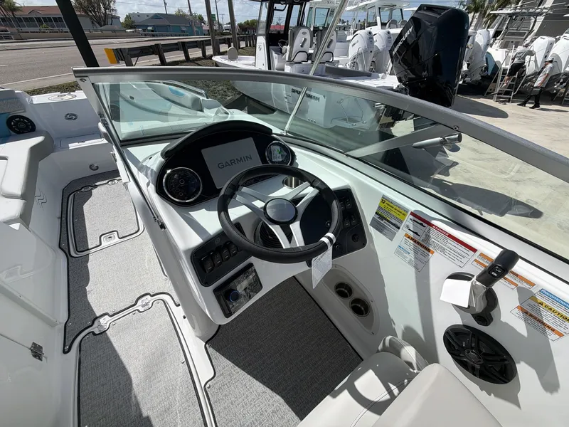 Slide: The Image of Interior view of 2026 Hurricane 2400 SD boat with Garmin controls. - 21